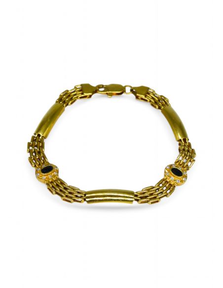 Pulsera semirigida  círculo con piedra negra oro 18k.